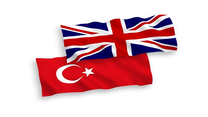 Flags of Turkey and Great Britain on a white background